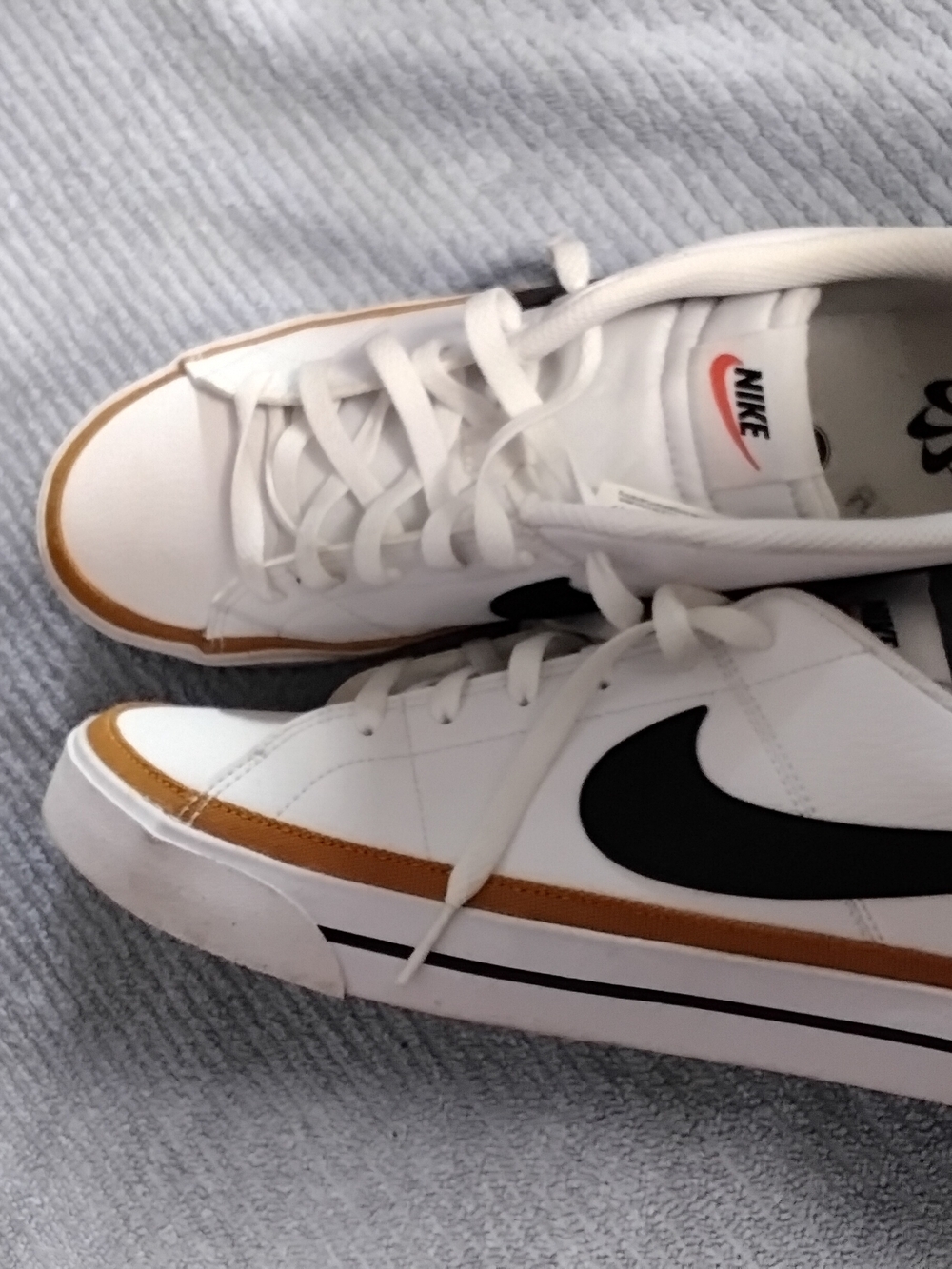 Nike White Sneakers with Black Swoosh and Tan Trim